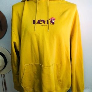 I am selling a yellow Levi’s sweater.